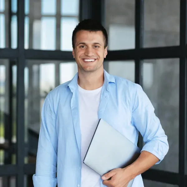 Careers Page. Man with laptop smiling